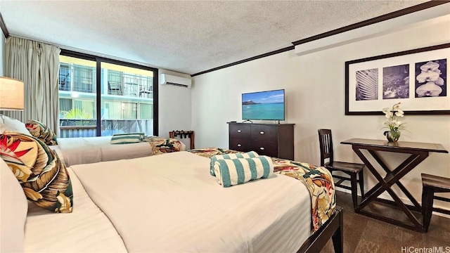 bedroom featuring dark hardwood / wood-style floors, a wall unit AC, access to exterior, crown molding, and a textured ceiling