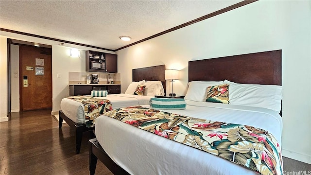 bedroom with crown molding, a textured ceiling, and dark hardwood / wood-style flooring