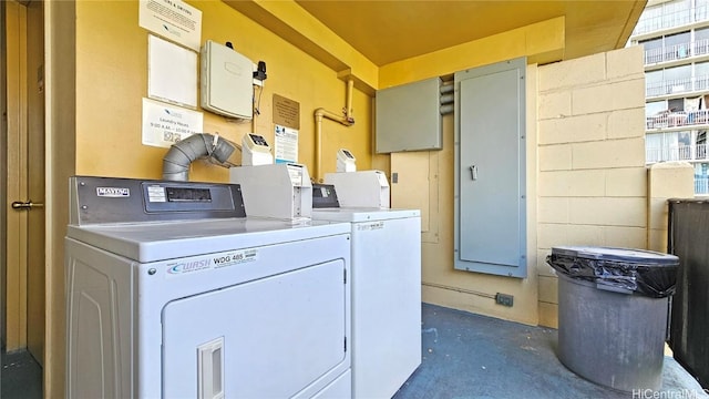 clothes washing area featuring washer and dryer