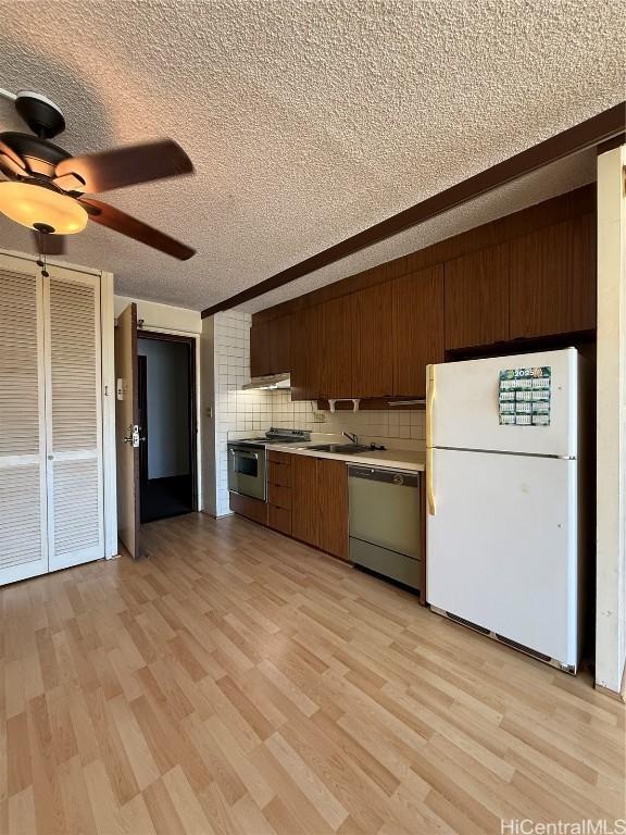 kitchen with stainless steel range with electric cooktop, light hardwood / wood-style flooring, dishwasher, white fridge, and backsplash