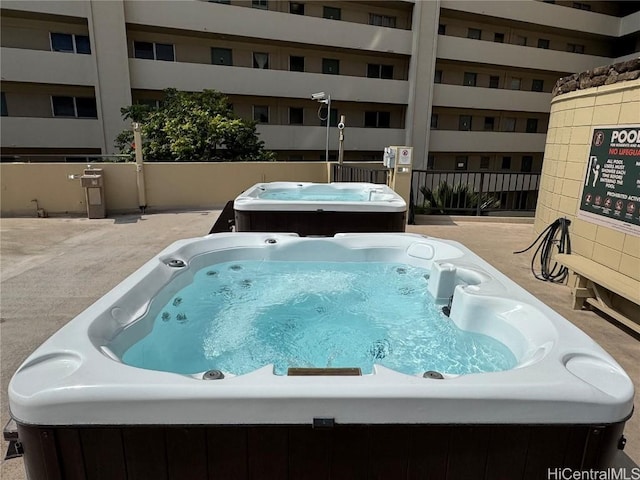 view of pool featuring a hot tub