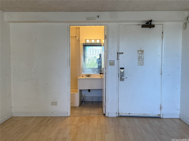 444 Niu St Unit 815, Honolulu, HI 96815 - entrance foyer with light wood-style flooring and baseboards