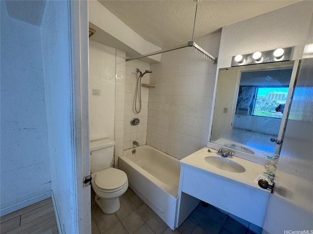 444 Niu St Unit 815, Honolulu, HI 96815 - bathroom with a textured ceiling, vanity, a textured wall, toilet, and tile patterned flooring