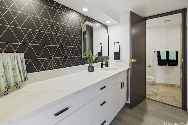 bathroom with vanity and toilet