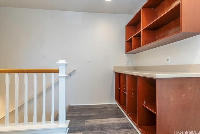 interior space with wood finished floors and baseboards