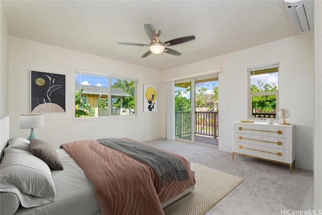 carpeted bedroom featuring access to outside and ceiling fan