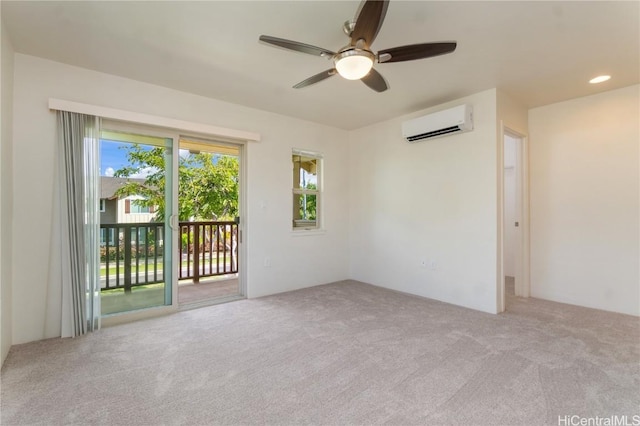 spare room with carpet floors, a wall unit AC, a ceiling fan, and recessed lighting