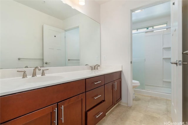 full bathroom featuring tile patterned flooring, toilet, a sink, a shower stall, and double vanity