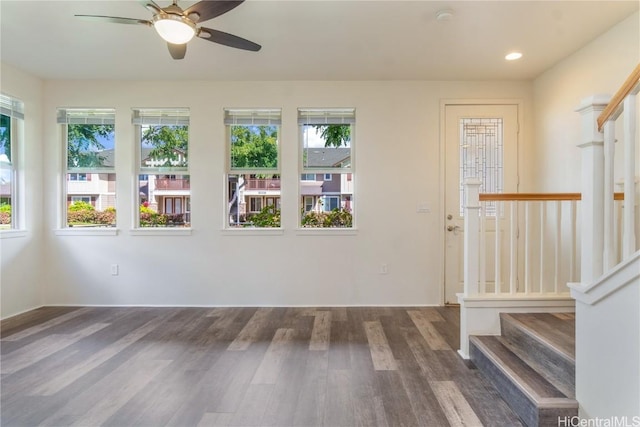 interior space featuring plenty of natural light, stairs, wood finished floors, and recessed lighting