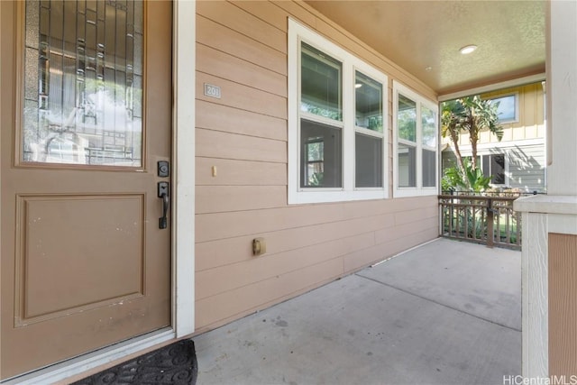 entrance to property featuring covered porch