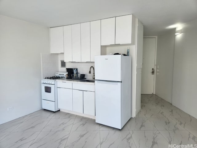 kitchen with white cabinetry, sink, white appliances, and backsplash