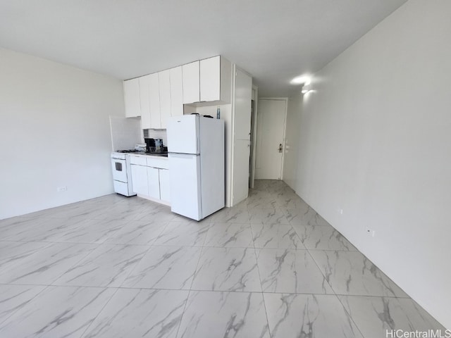 kitchen with white cabinetry and white appliances