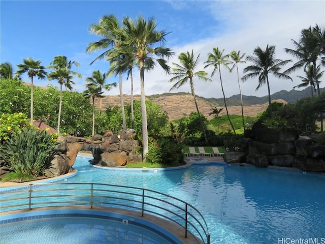 view of swimming pool featuring a mountain view