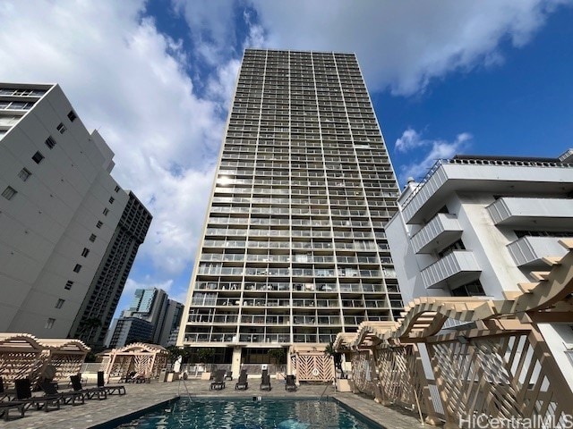 view of pool featuring a pergola and a patio area