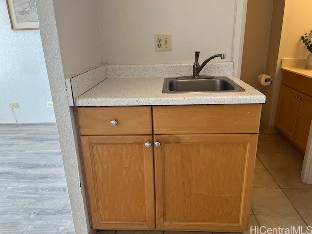 kitchen with sink and light tile patterned floors