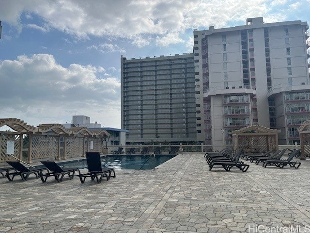 view of swimming pool featuring a patio area