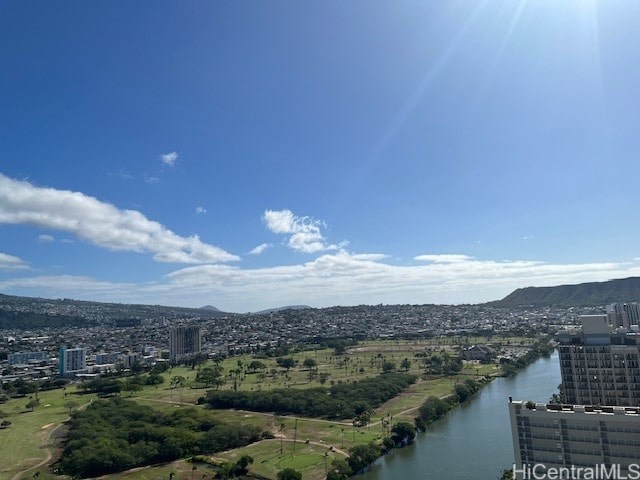 drone / aerial view with a water and mountain view