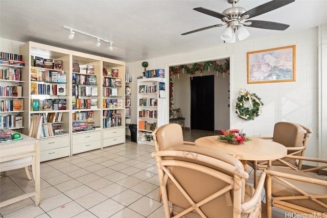 tiled dining room featuring ceiling fan