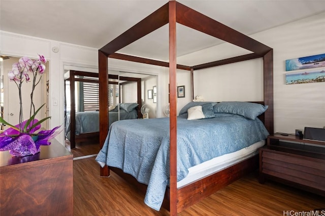 bedroom featuring dark hardwood / wood-style flooring