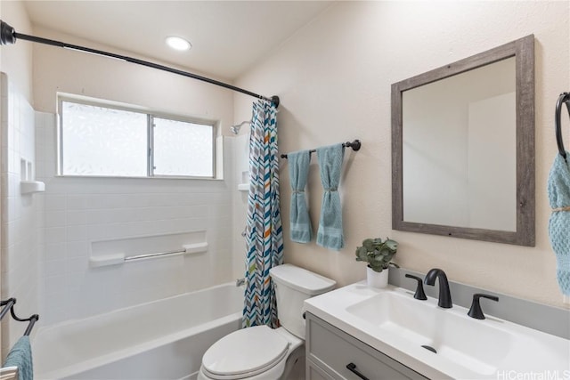 full bathroom with toilet, vanity, and shower / bathtub combination with curtain