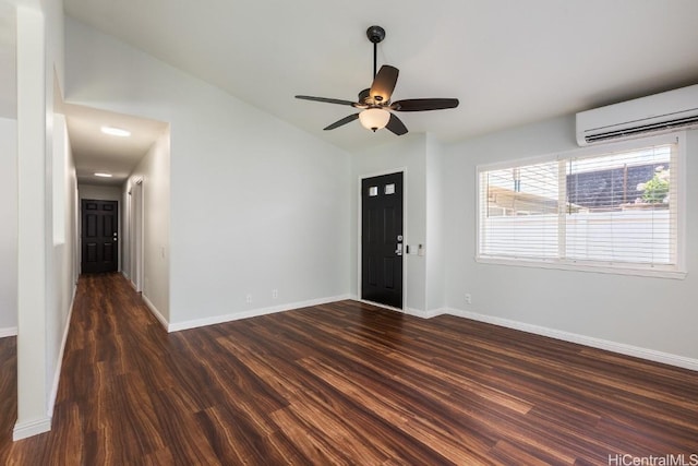 interior space with lofted ceiling, ceiling fan, dark hardwood / wood-style floors, and a wall mounted AC