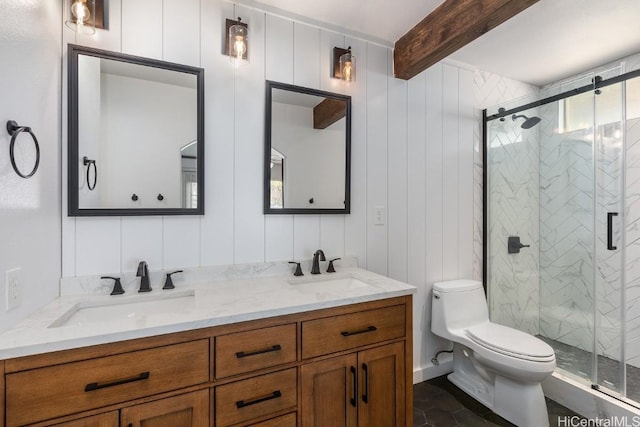 bathroom featuring beamed ceiling, vanity, and walk in shower