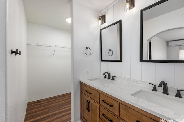 bathroom featuring vanity and wood-type flooring