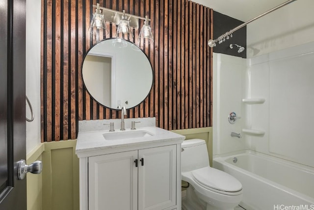 full bathroom featuring shower / bath combination, vanity, and toilet