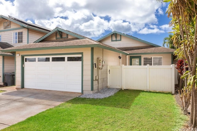 view of front facade with a garage and a front lawn