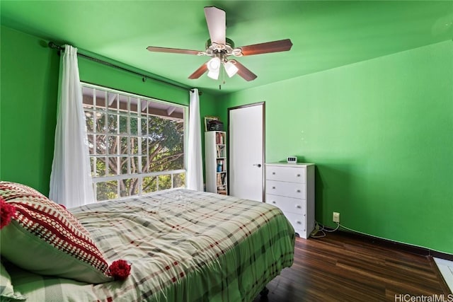 bedroom featuring dark hardwood / wood-style floors and ceiling fan