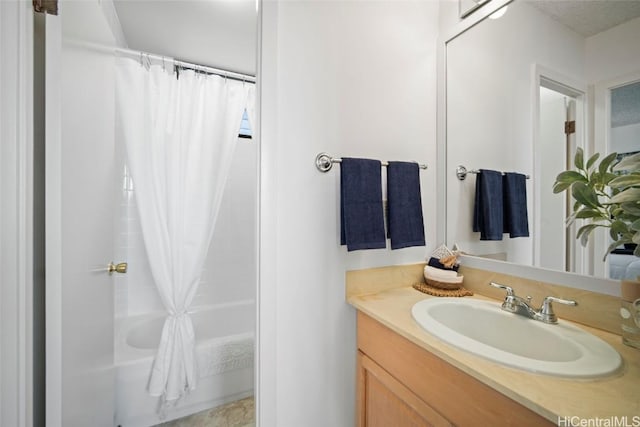 bathroom featuring vanity and shower / bath combo with shower curtain