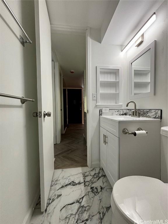 bathroom with vanity and toilet