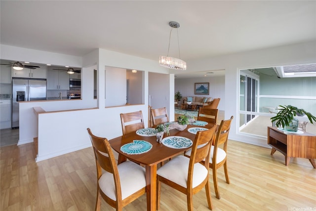 47-505 Lulani St, Kaneohe, HI 96744 - dining space featuring light wood-style floors, a ceiling fan, and a chandelier