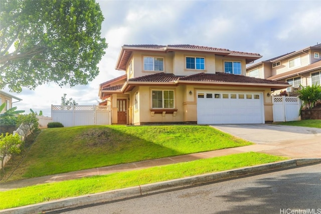 mediterranean / spanish-style house with a garage and a front yard