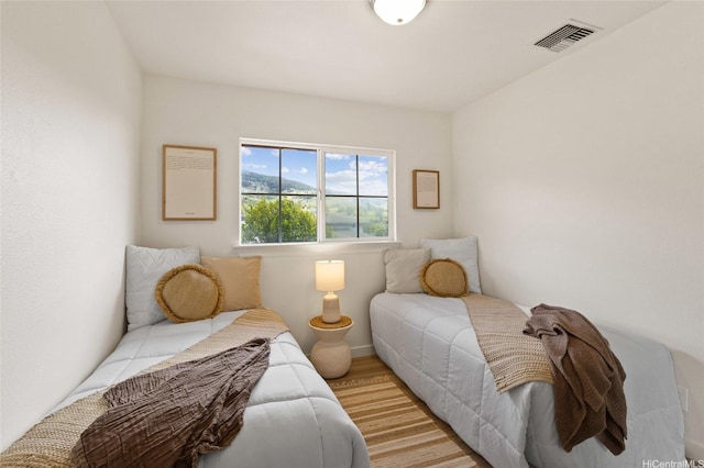 92-6012 Kohi St, Kapolei, HI 96707 - bedroom with light wood-style floors and baseboards