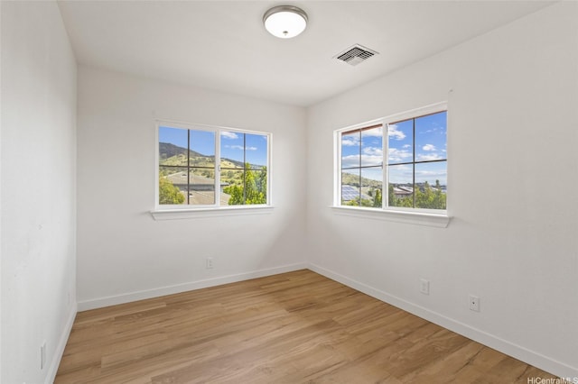 92-6012 Kohi St, Kapolei, HI 96707 - spare room with baseboards and light wood-type flooring