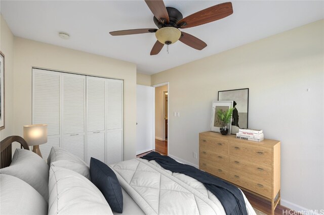 bedroom featuring ceiling fan and a closet