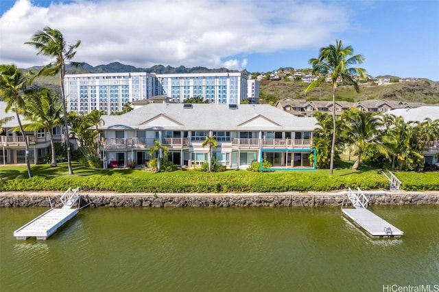 birds eye view of property featuring a water and mountain view