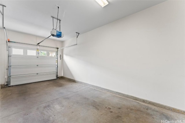 garage with baseboards and a garage door opener