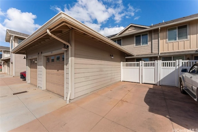 exterior space featuring fence and board and batten siding