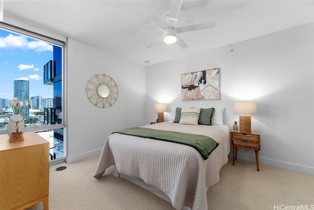 carpeted bedroom featuring access to outside and ceiling fan