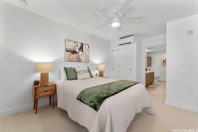 carpeted bedroom with ceiling fan, connected bathroom, a closet, and an AC wall unit