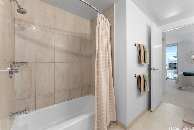 bathroom with tile patterned floors and shower / tub combo