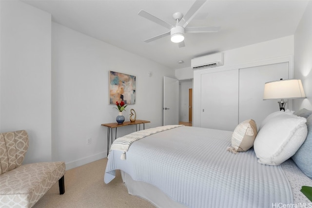 bedroom featuring a closet, light colored carpet, an AC wall unit, and ceiling fan