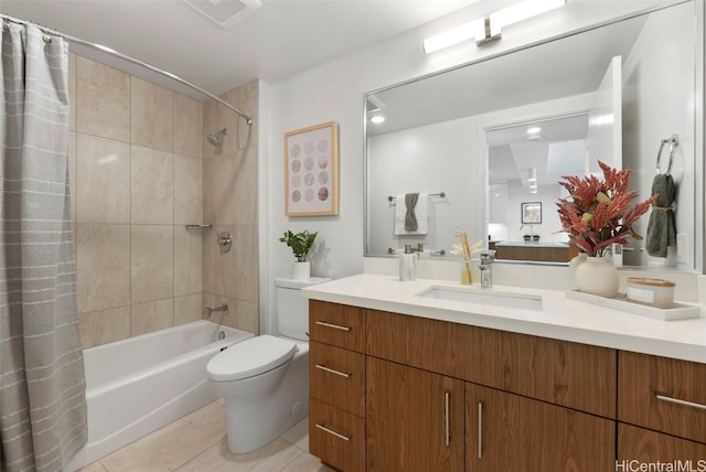 full bathroom featuring vanity, shower / tub combo with curtain, and toilet