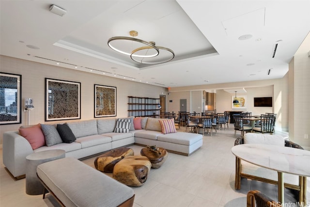 living room with a raised ceiling