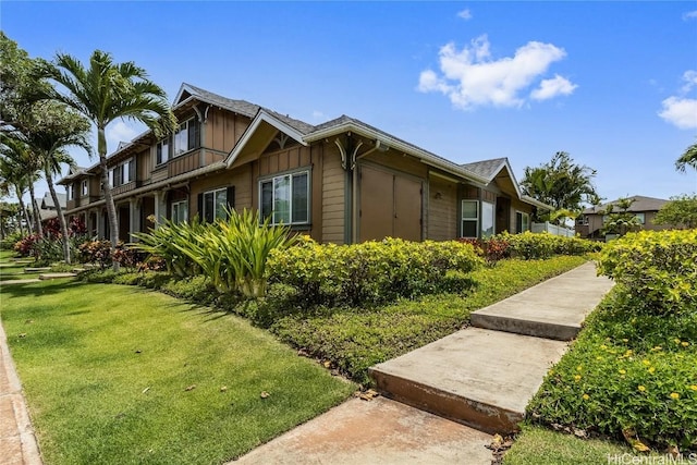 view of home's exterior featuring a yard