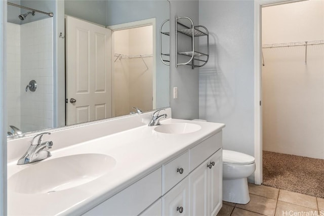 bathroom featuring tile patterned floors, toilet, and vanity