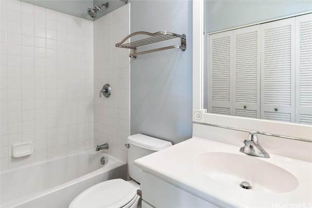 full bathroom with vanity, toilet, and tiled shower / bath