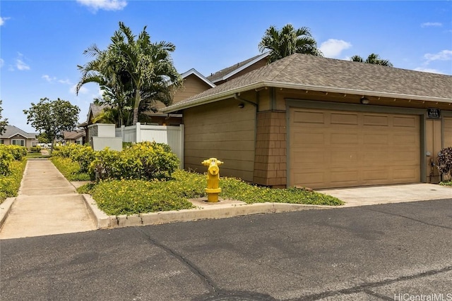 view of side of property featuring a garage